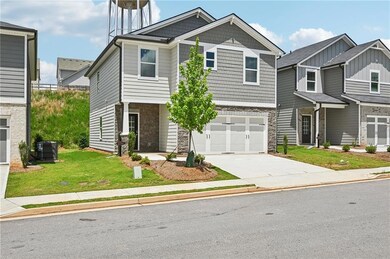 Craftsman house featuring stone siding, concrete driveway, a garage, and a front yard