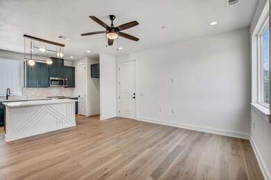 Kitchen with stainless steel microwave, backsplas