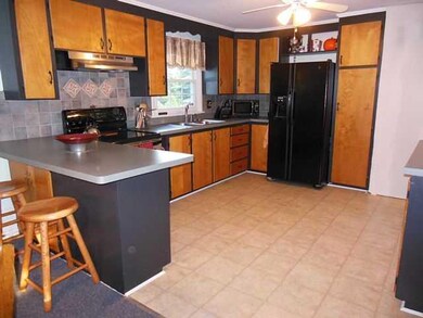 Kitchen another view with breakfast bar