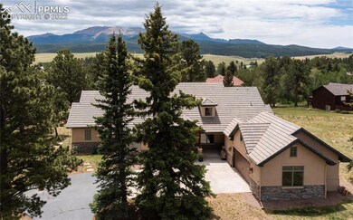 Exterior front view, with Pikes Peak in the backgr