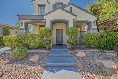 Mediterranean / spanish home with stucco siding and stone siding