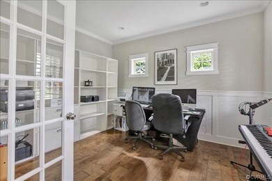 Off the foyer, through french doors is the office,