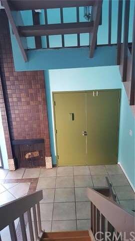 SECOND LEVEL LOOKING DOWN AT FRONT DOOR
