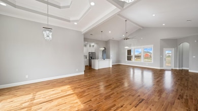 Unfurnished living room featuring arched walkways,