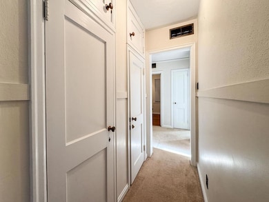 Hallway connecting living rom to bedrooms