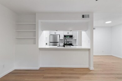 Modern kitchen with a pass-through window and bar