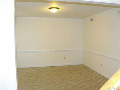 Living/dinning room with berber carpet