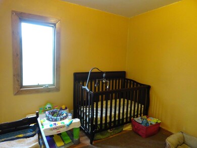 Bedroom with laundry & clothes closet