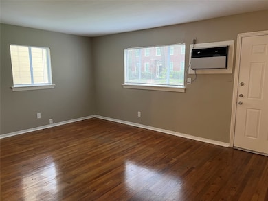 Living room with wood flooring.