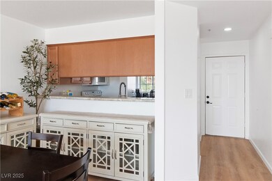 Kitchen featuring light wood-type flooring and baseboards