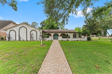 The main home features soaring ceilings in the large living area, a dedicated office/flex space, and a gameroom perfect for entertaining.