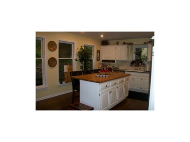 Rich hardwood floors.. lots of windows let the sun