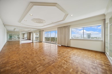 Spacious living room with parkay flooring and full