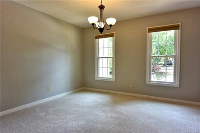Dining room with new carpet and fresh paint.