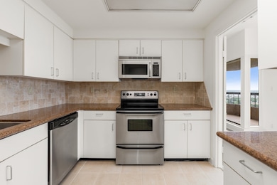 Kitchen with granite counters and stainless applia