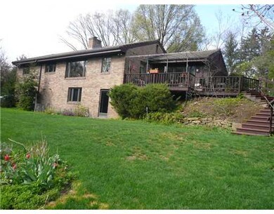 Exterior Back. Walkout finished basement with door