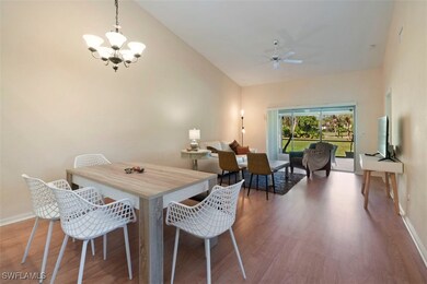 Dining area with high vaulted ceiling, ceiling fan