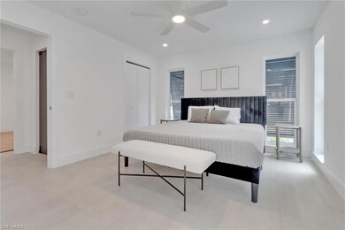 Bedroom with a closet, baseboards, a ceiling fan, 