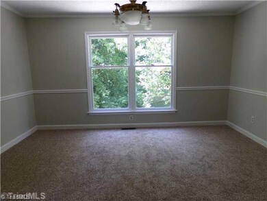 Dining Room. The formal dining room can accommodate a 12-seater banquet table and still has room for a china cabinet and a buffet table.