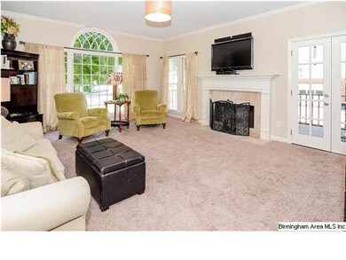 Large family room with fireplace and paladian wind