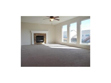 Spacious great room with floor to ceiling windows 