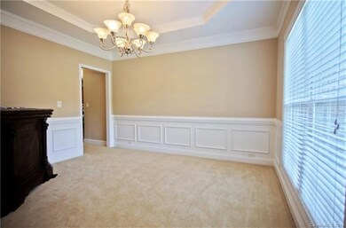 Large Dining room with tray ceiling and molding.