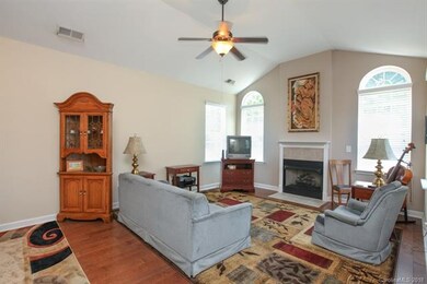 Vaulted living area, gas log fireplace and palladi