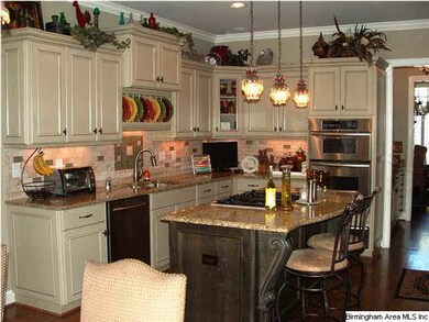 Updated eat-in kitchen features custom cabinetry, 