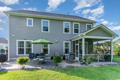 Rear view of property with ceiling fan, a patio, a