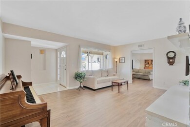 Living room looking in towards family room.  Notice the separate foyer at front door.