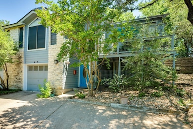 View of front of home featuring driveway, a garag