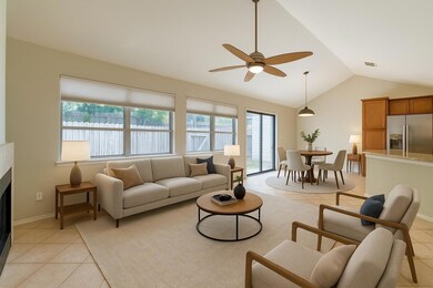 Living room with lofted ceiling, a wealth of natu