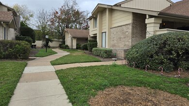 Nicely landscaped walkway leading to entrance.