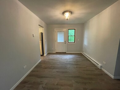 Rear entry to upstairs unit. Can be used as formal