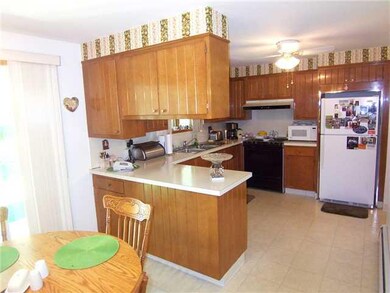 Kitchen. KITCHEN OPENS TO DINING L.