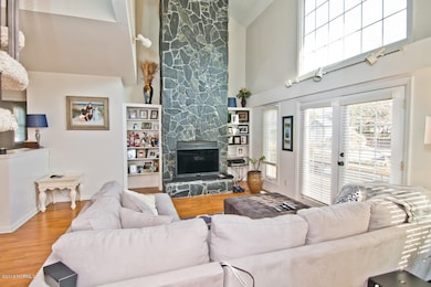 High Ceilings showcase stone Fireplace!