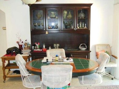 Dining area off of the kitchen with matching china