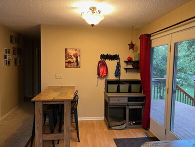 Dining space with a textured ceiling, plenty of na