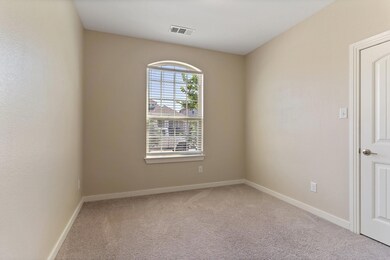 Spare room with carpet flooring