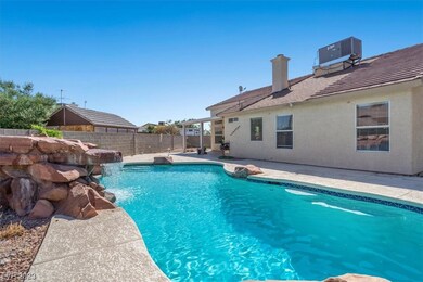 Refreshing Pool with Rock Waterfall Features perfe