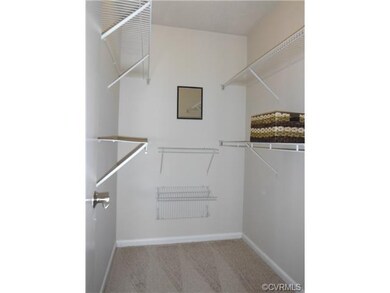 Master closet. Walk-in with lots of shelf storage