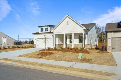 View of front of property featuring a garage and c