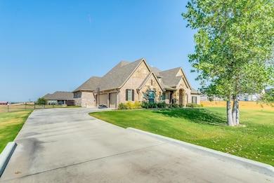Three car garage. Beautiful landscaping.