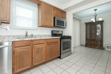 The kitchen has tile flooring and comes fully applianced.