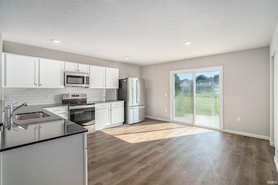 The dining nook can accommodate a large table and has direct access to the rear yard.