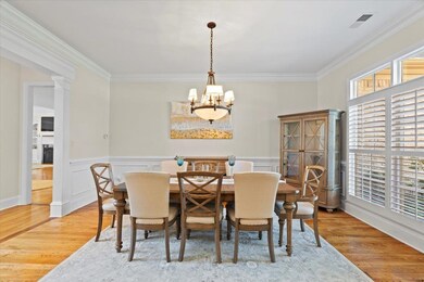 Dining area featuring an inviting chandelier, hard