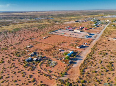Aerial overview of property's location featuring rural landscape and a desert landscape