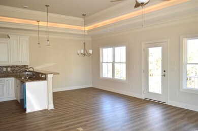 Kitchen with kitchen peninsula, ornamental molding