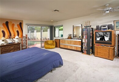 The large master suite is enriched with recessed lighting, a ceiling fan, built-in dressing table with double mirrors, His and Her closets with built-in drawers to maximize storage and plush carpet; plus a private bathroom with walk-in tub and large 