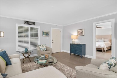 Spacious living and dining room with wood flooring